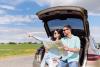 Couple reading map in car